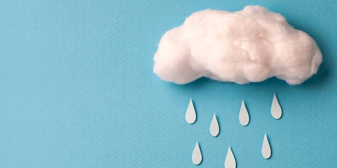 Cotton wool cloud with cut out paper rain drops