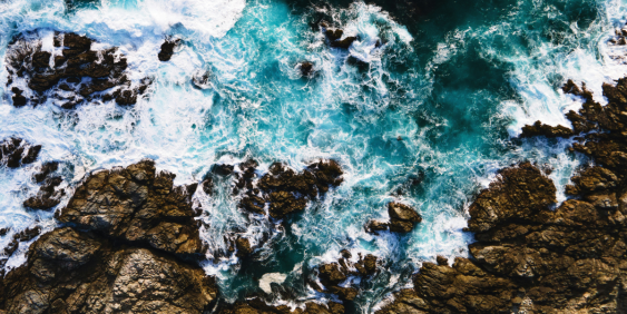 waves crashing on rocks