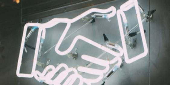 neon lights of hand shake