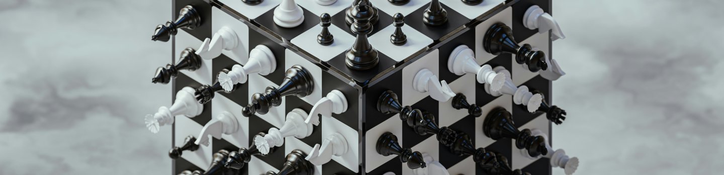 A tower constructed from chess pieces stands against a backdrop of a fluffy cloud in a blue sky.