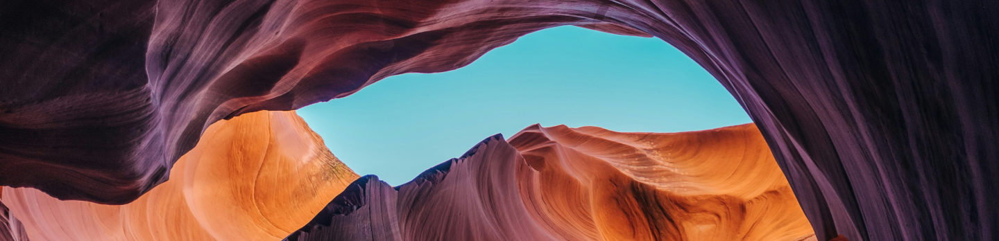 A stunning view of Antelope Canyon in Arizona, showcasing its vibrant red rock formations and narrow passageways.