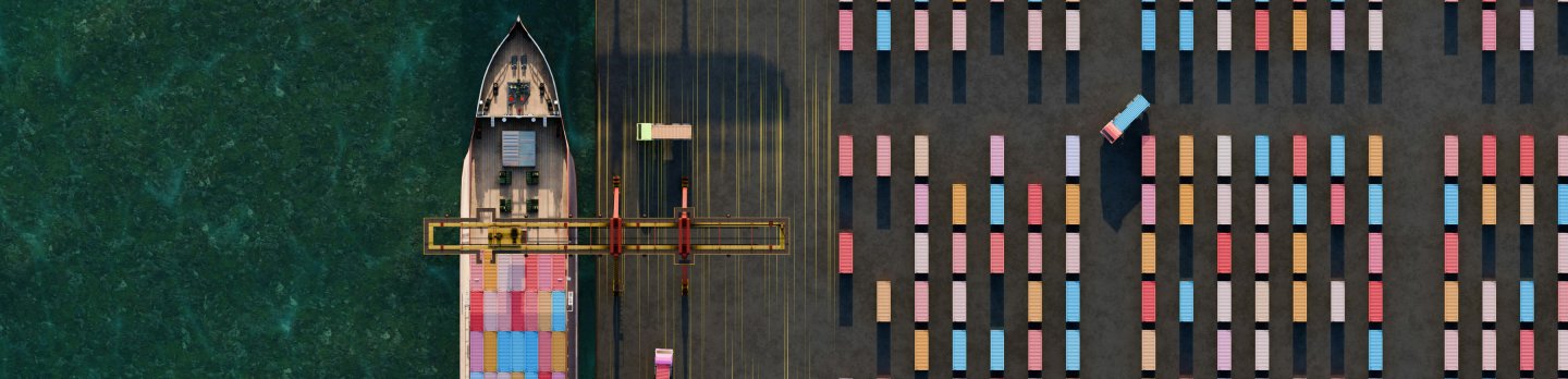 Aerial view of a small cargo boat beside a container ship, colorful stacked containers, and dark green water creating striking contrast.