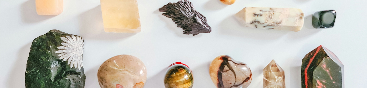 A diverse assortment of rocks and minerals displayed together, showcasing various colors, textures, and shapes.