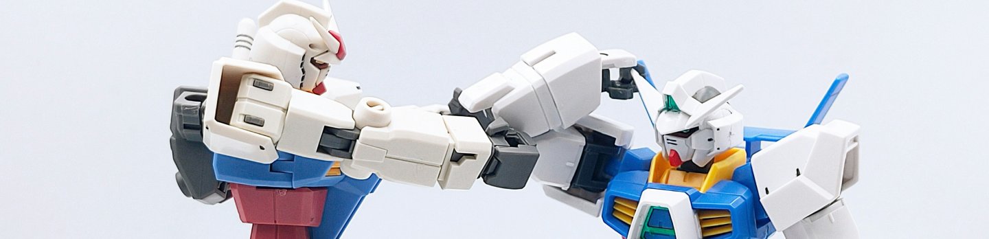 Two toy robots clashing in a mock fight against a white backdrop, highlighting their vibrant colors and action-oriented poses.