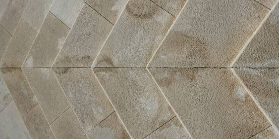 A vibrant sunset illuminates Stonehenge, highlighting the iconic stone circle against a colorful sky in England.