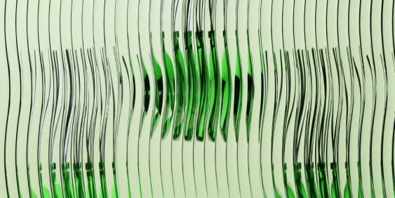 A green glass bottle stands upright against a plain white background.