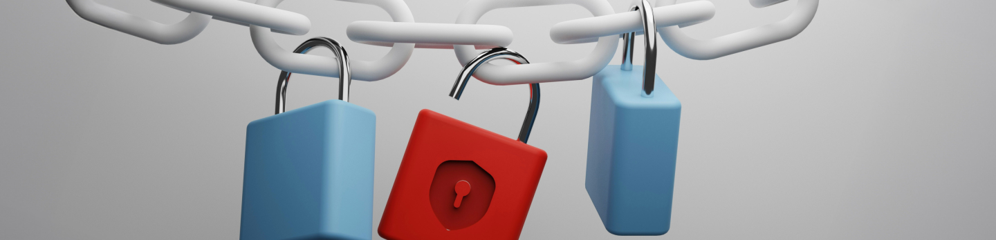 A white chain with two blue padlocks and one red padlock hanging from it, symbolising security and protection, against a gray background.