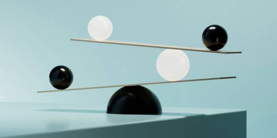 A stylish table lamp featuring two decorative balls as part of its design.