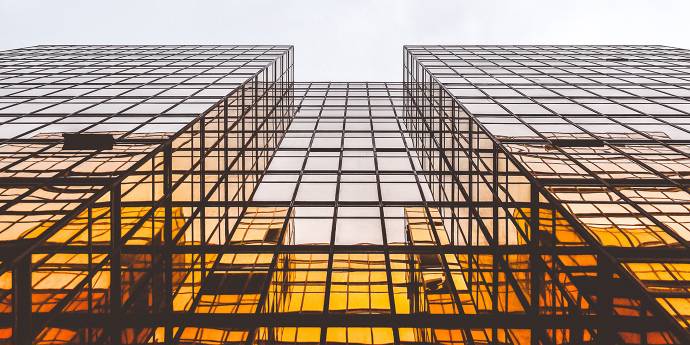 Glass building with golden light on windows