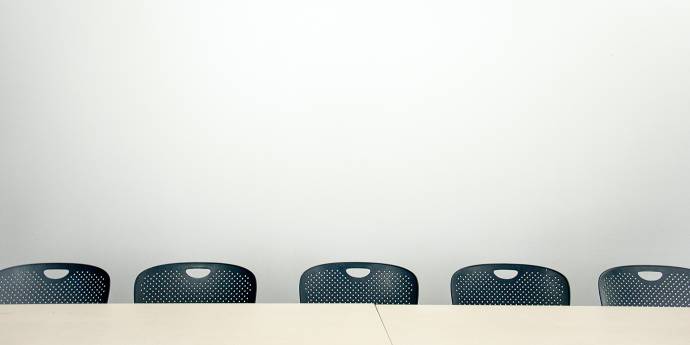 Empty chairs at a table