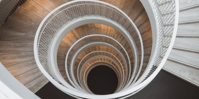 Looking down a spiral staircase into blackness