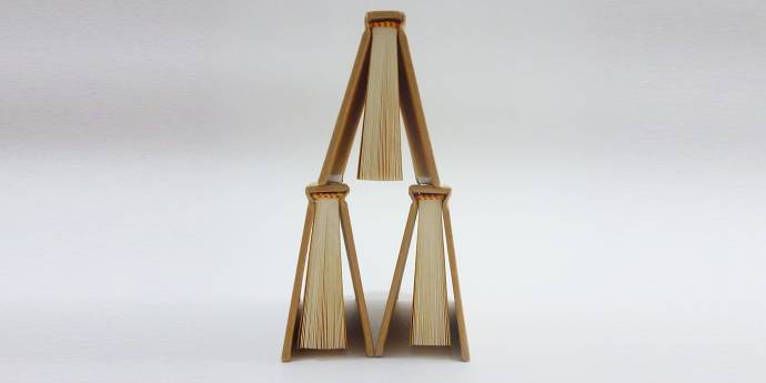 books stacked in tower formation