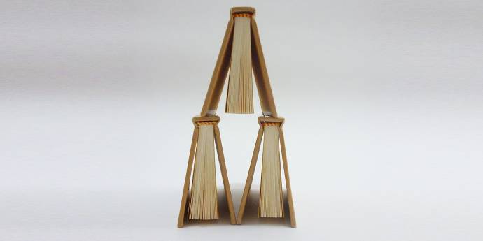 books stacked in tower formation