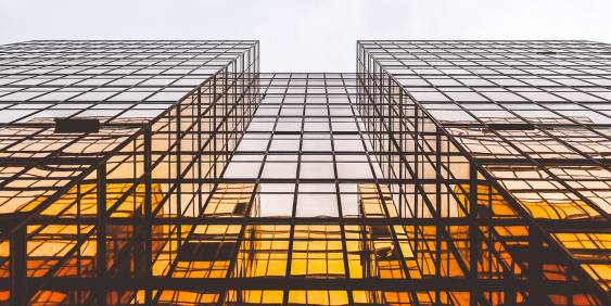 Glass building with golden light on windows