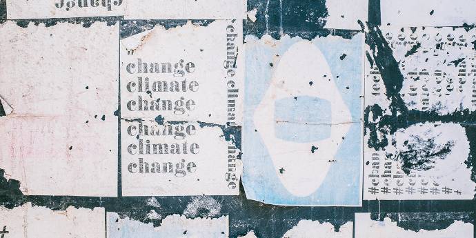 torn paper with the words climate change printed on it over many lines