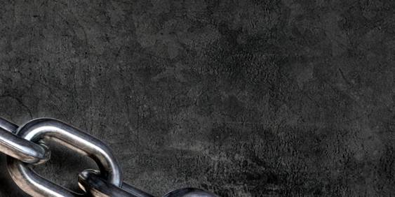 metal chain against a black wall