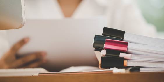  Desk perspective showing part of a person 