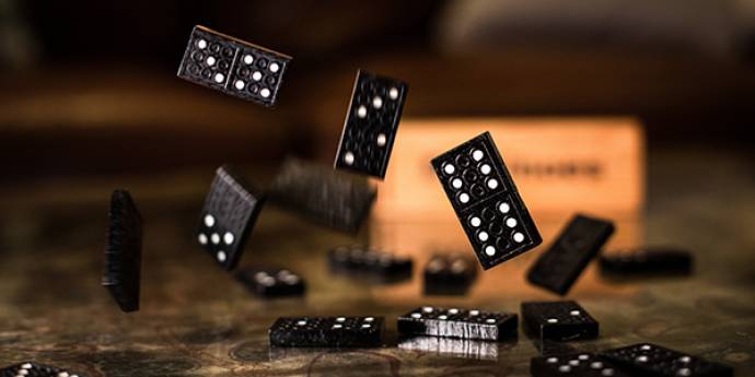 Dominoes falling on a table