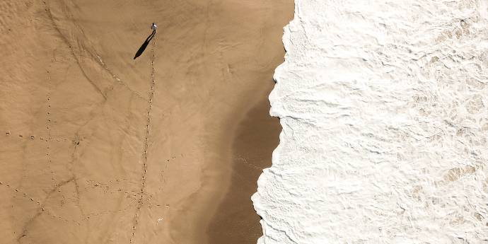 Looking down on a person walking on a beach