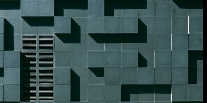 Grey maze block pattern on wall
