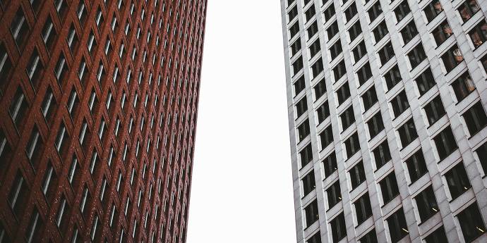 Looking up at two skyscrapers facing each other