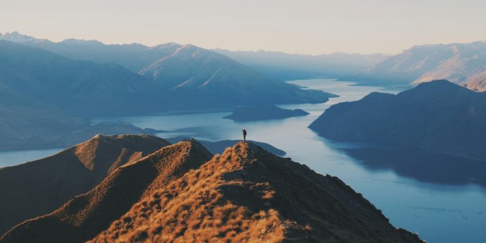 Person standing on mountain top