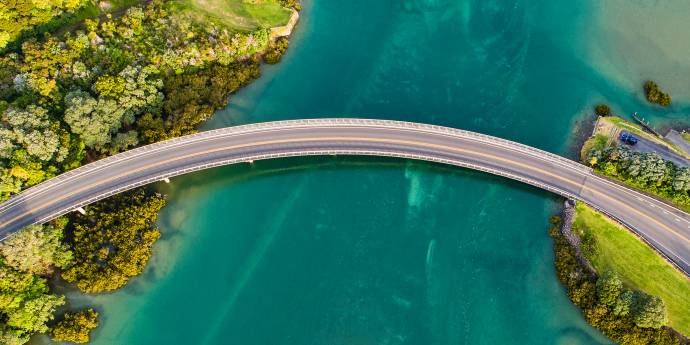 looking down on a road bridge across an estuary