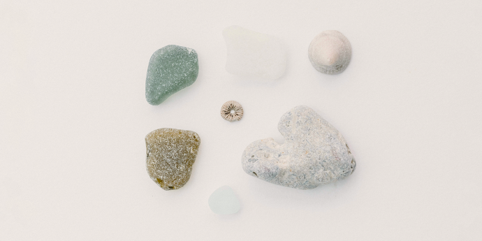 looking down on beach and green sea