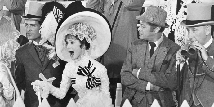 black and white image of people watching horse racing