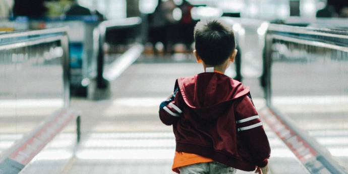 Child running through an airport 
