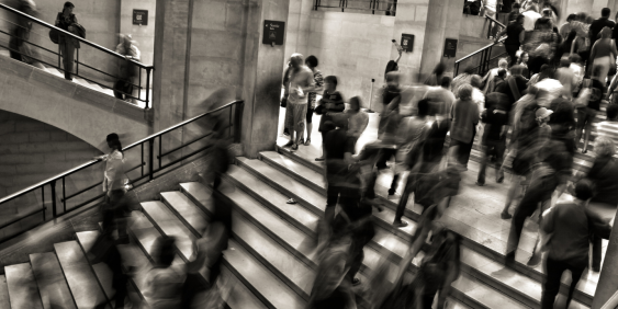 blurred people walking up and down stairs