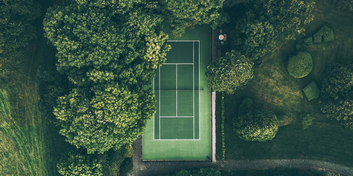 Tennis court and trees seen from above