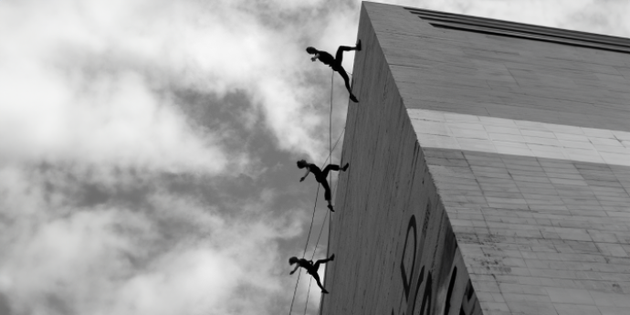 photo of performance abseiling on a concreate wall