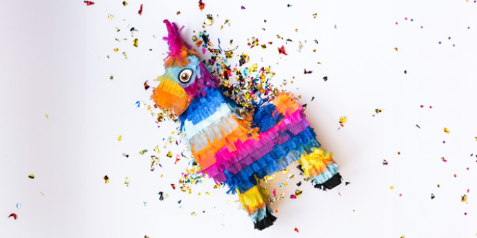 colourful pinata with tinsel inside