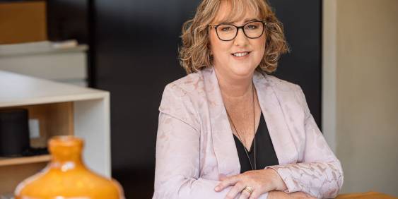 IoD CEO Kirsten Patterson sitting  and smiling at the camera