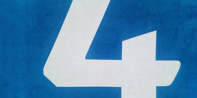 white four painted on blue wall
