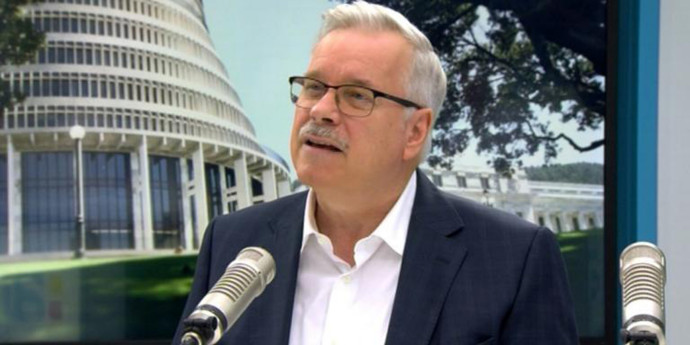 Stephen Jacobi speaking into a microphone