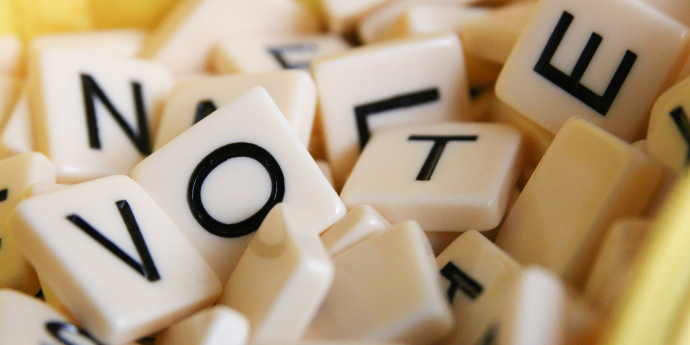 Scrabble blocks used to spell the word vote