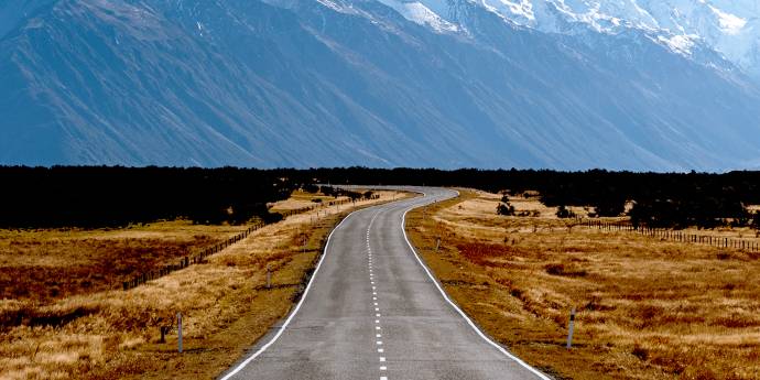 Road leading to a mountain.