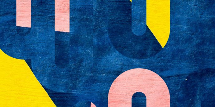 black numbers painted on yellow wall