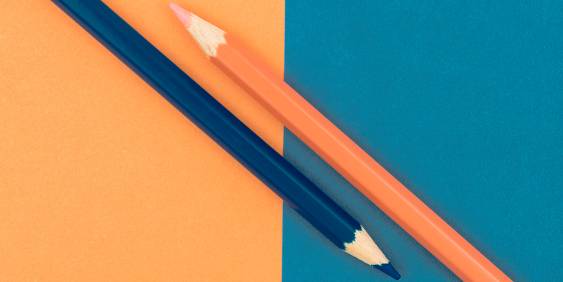 blue and orange pencil on blue and orange card