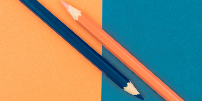 blue and orange pencil on blue and orange card