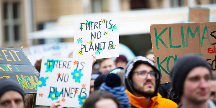 Photo of climate change protesters holding placards